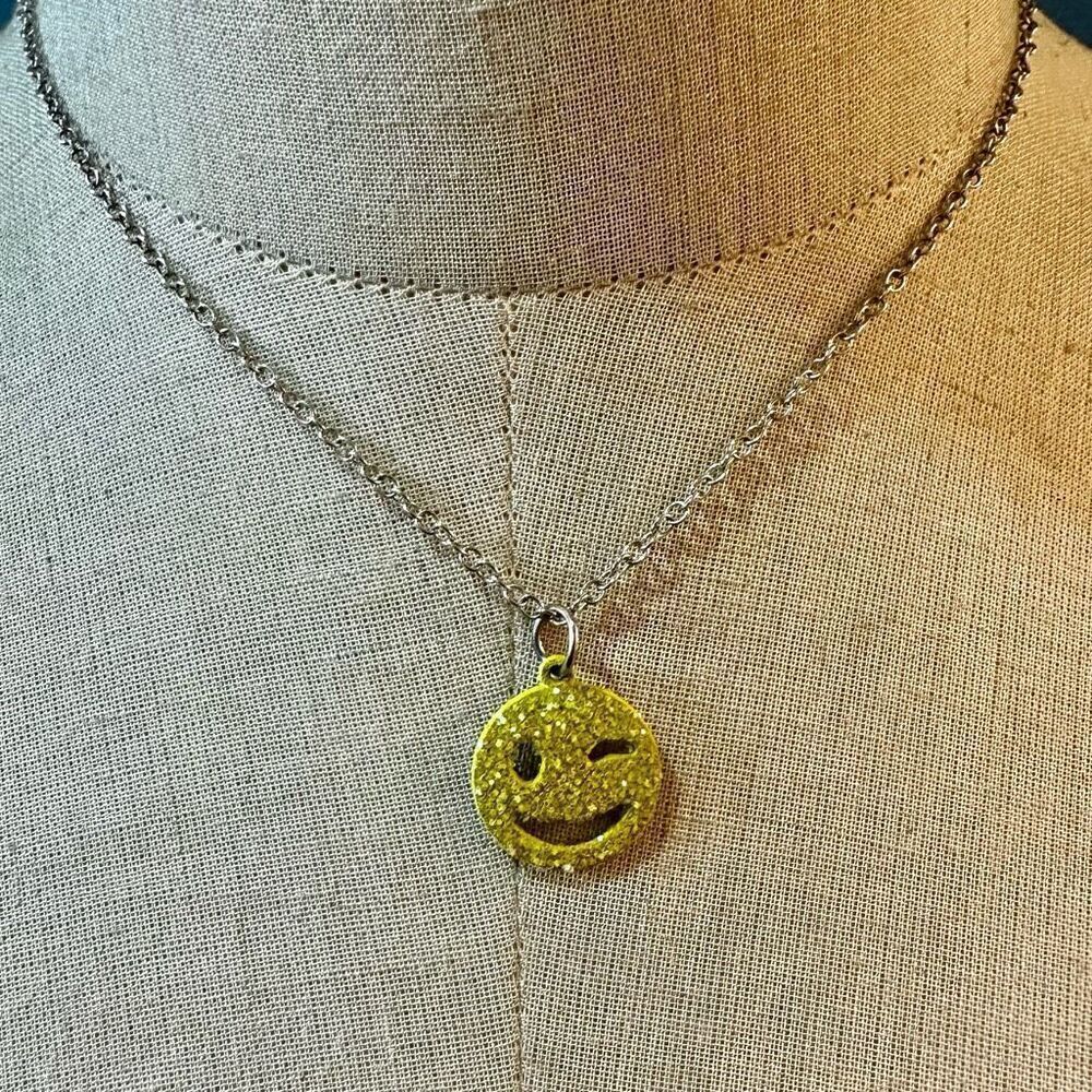 Yellow winking smiley face pendant necklace